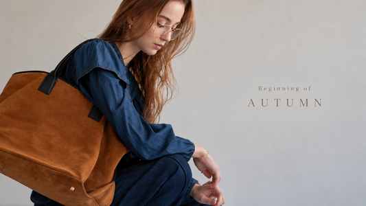 An autumn outfit styled with a brown suede bag