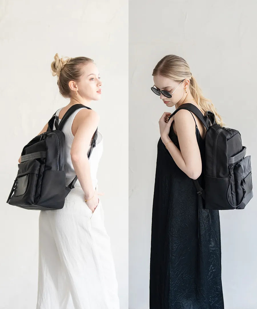 A female model carrying a backpack "Ragalo" Color:Black