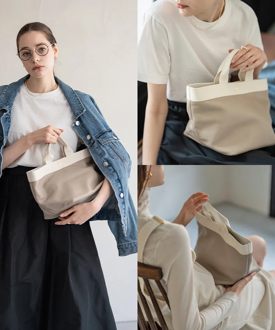 A female model is holding a tote bag "Emmalde" in colors: Light Greige x Ivory.