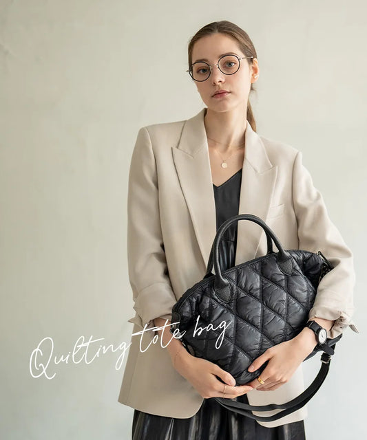 A female model is holding a hand bag "Lanef".Color:Black