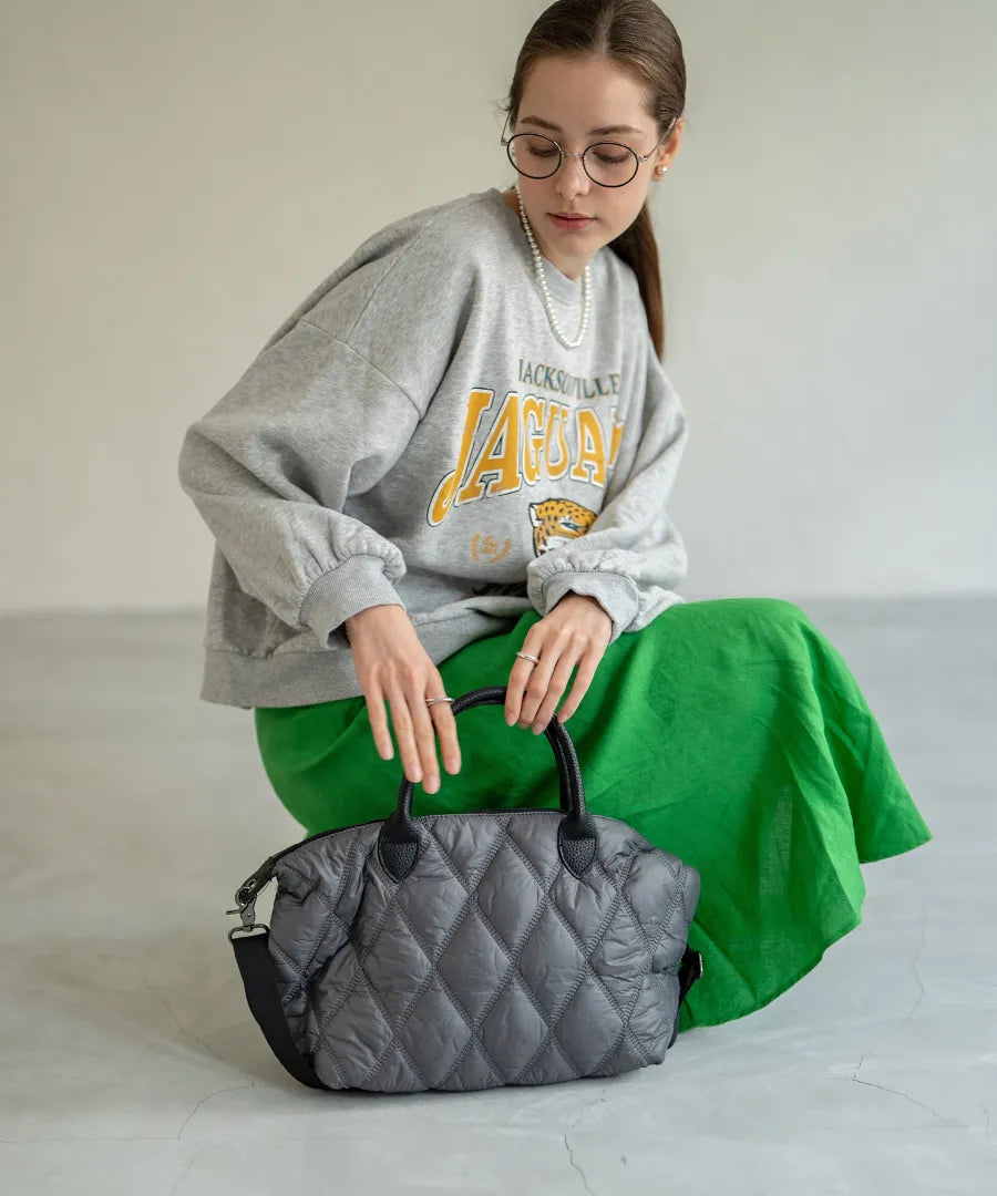 A female model is holding a hand bag "Lanef".Color:Gray