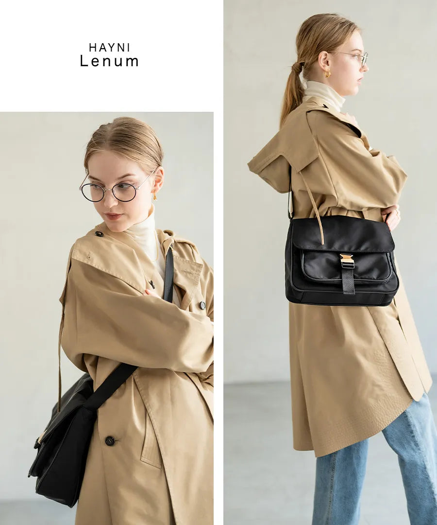 A female model is carrying a shoulder bag “Lenum” over her shoulder. Color:Black