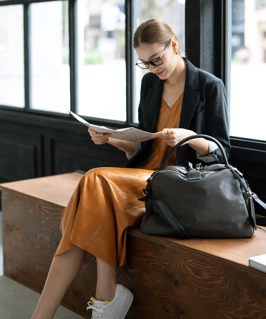 This bag "Nylon Loche L" is next to the woman.